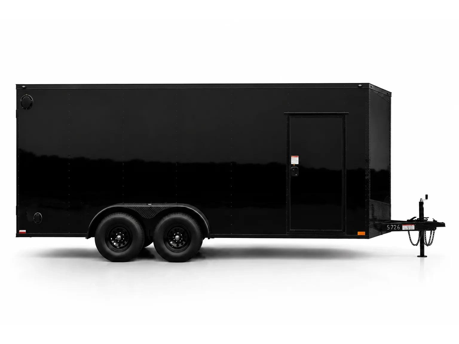 Glossy Elite blackout trailer, wide side profile, set up as a mobile storefront